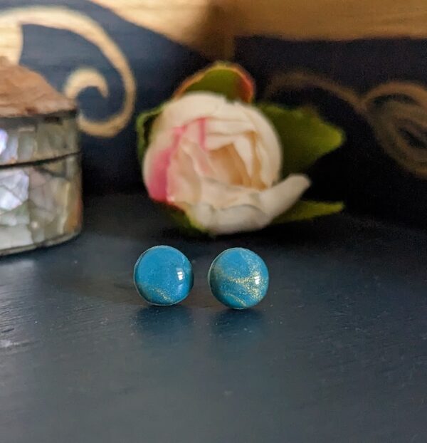 Opals studs collection - beautiful blues with hints of gold small stud earrings. Opal effect and sterling silverear posts and backs